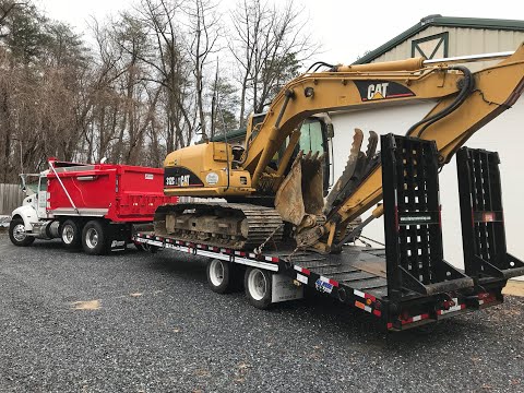 Class B with a heavy equipment trailer