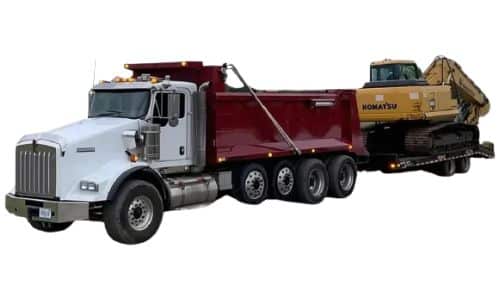 Dump Truck pulling a trailer with an excavator